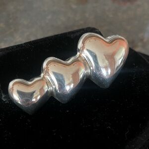 Sterling silver puff heart pin.